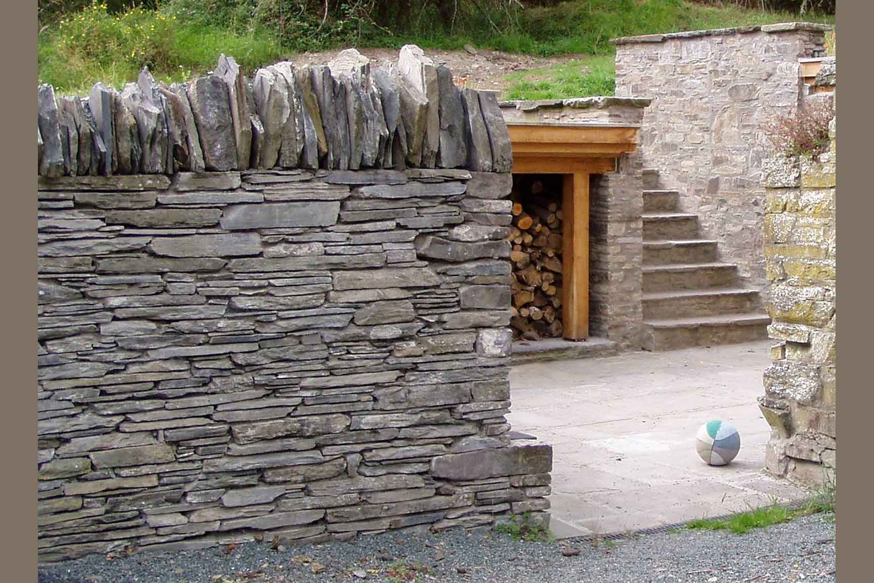 The Playbarn: drystone wall, steps, log store